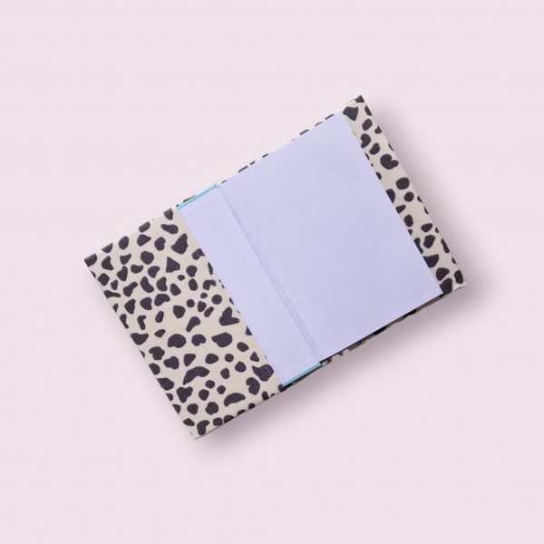 A5 notebook cover - black/cream animal print with pink spine.