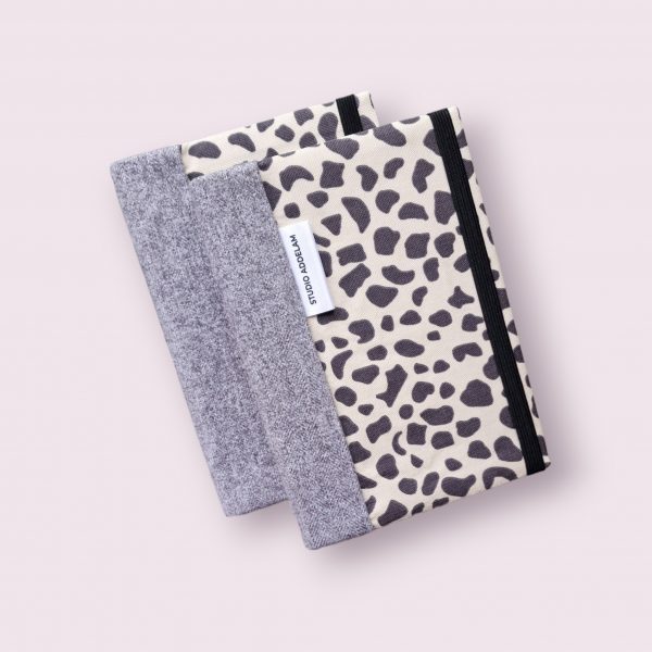 A5 notebook cover - black/cream animal print with grey spine.