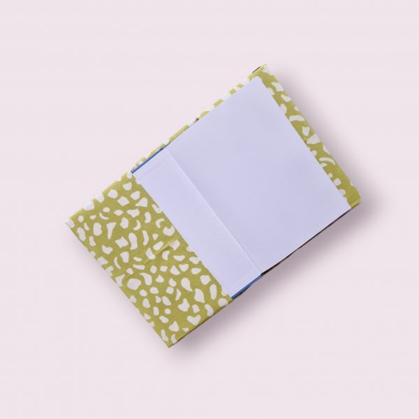 A5 notebook cover - green/cream animal print with pink spine.