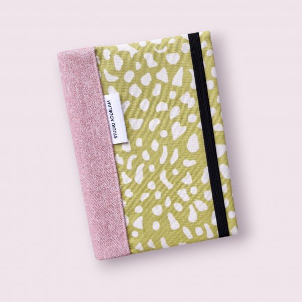 A5 notebook cover - green/cream animal print with pink spine.